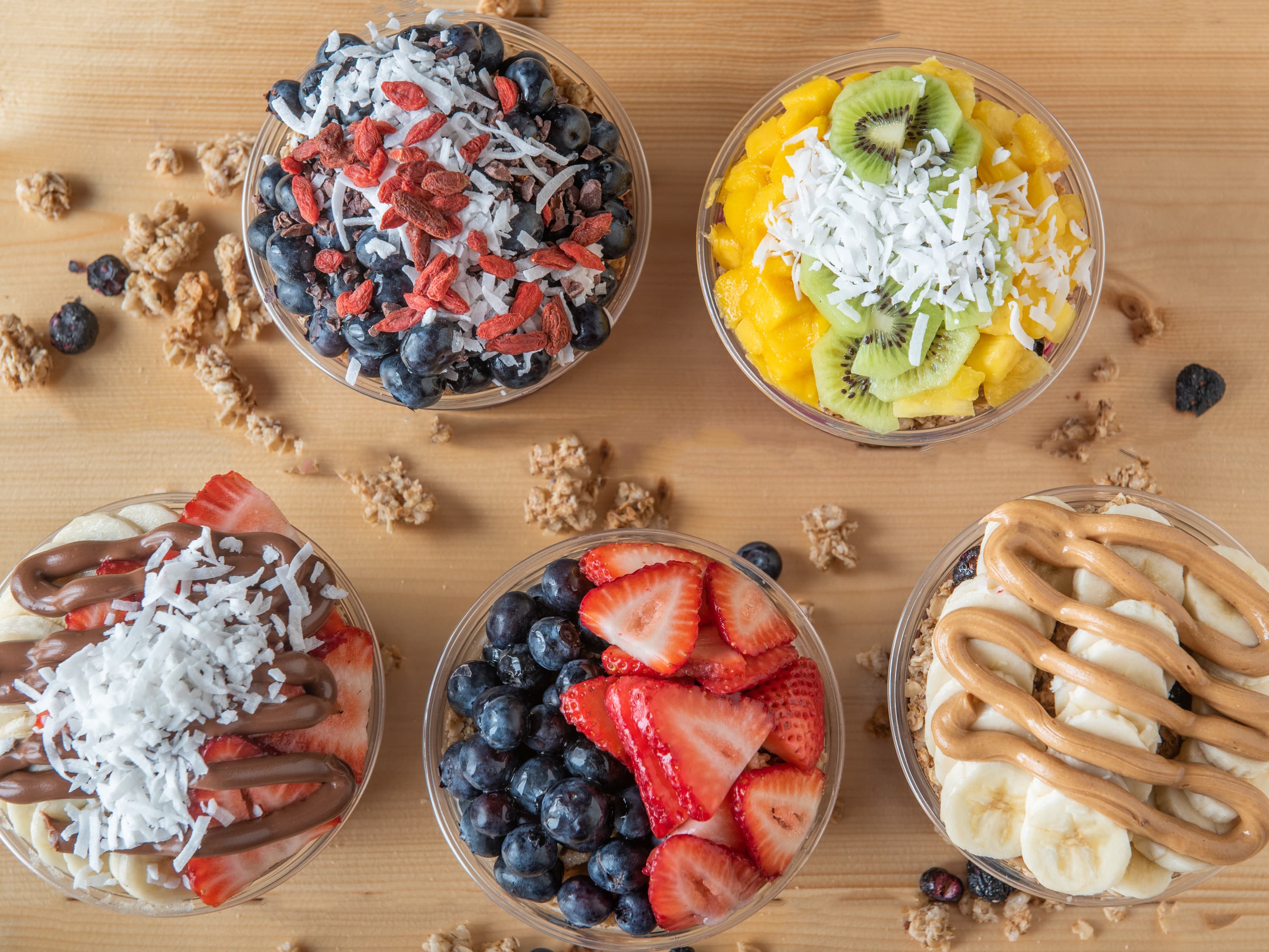 A spread of fresh Bonita Bowls açaí bowls arranged for a catered event